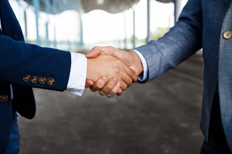 Business professionals shaking hands